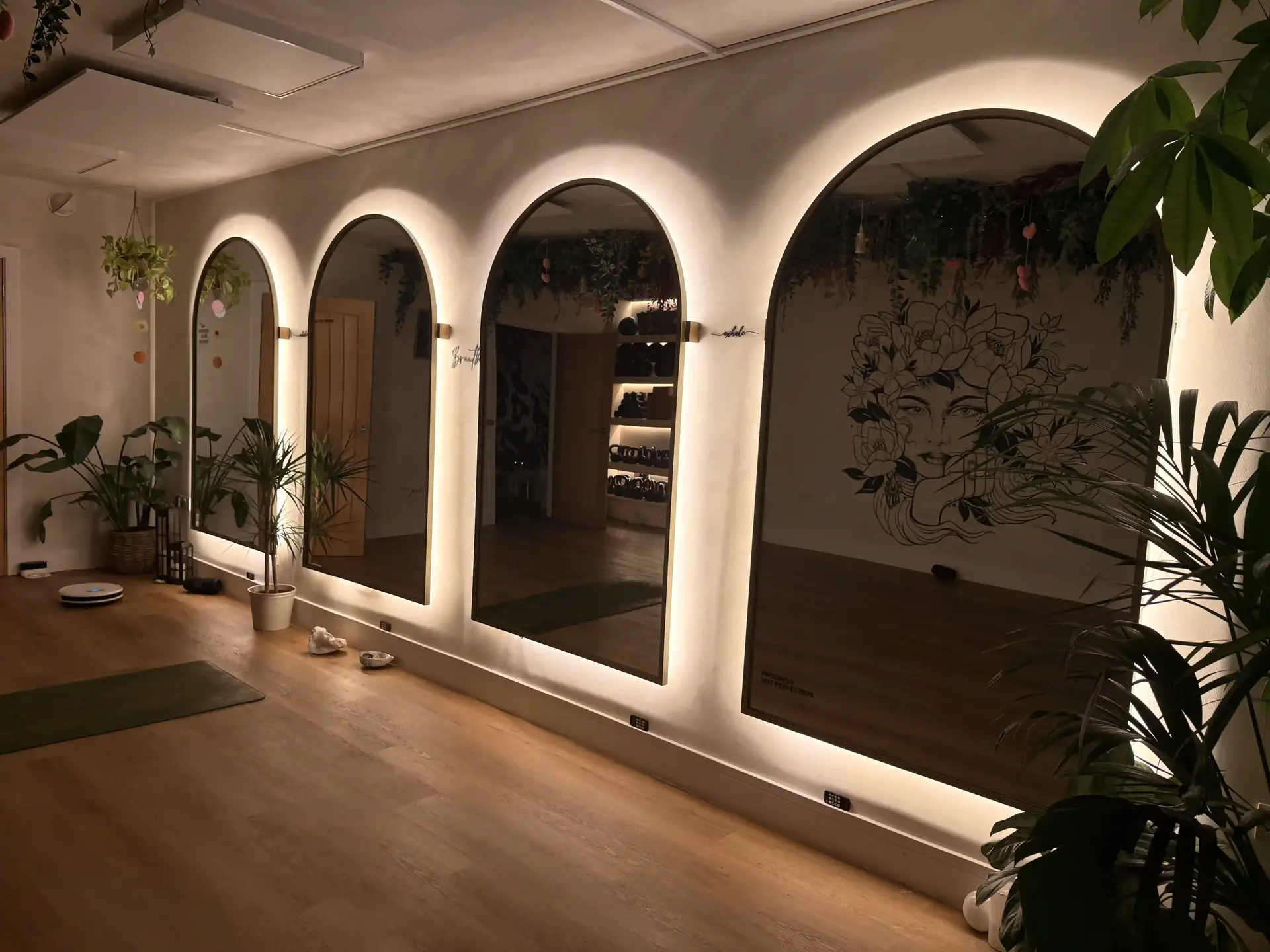 Pilates reformer studio with soft lighting